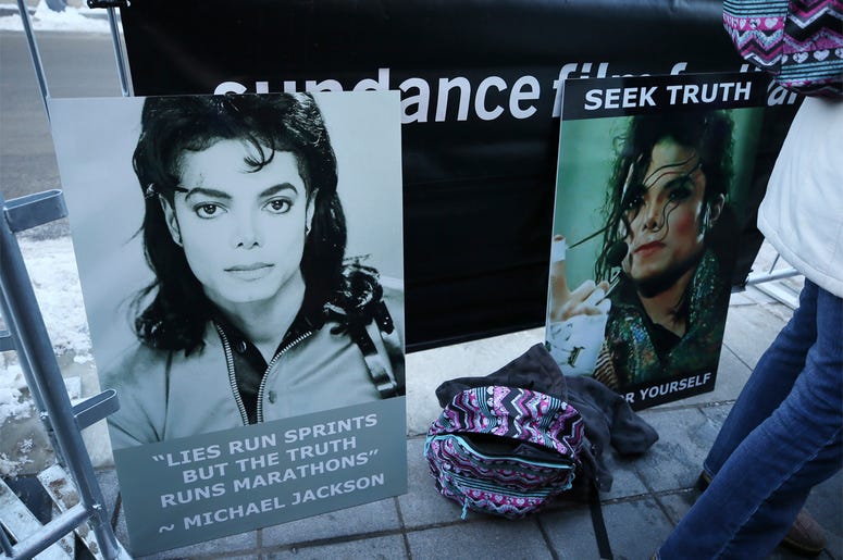 AP19025645016961 Signs in support of Michael Jackson are seen outside of the premiere of the "Leaving Neverland" Michael Jackson documentary film at the Egyptian Theatre on Main Street during the 2019 Sundance Film Festival, Friday, Jan. 25, 2019, in Park City, Utah. (Pho