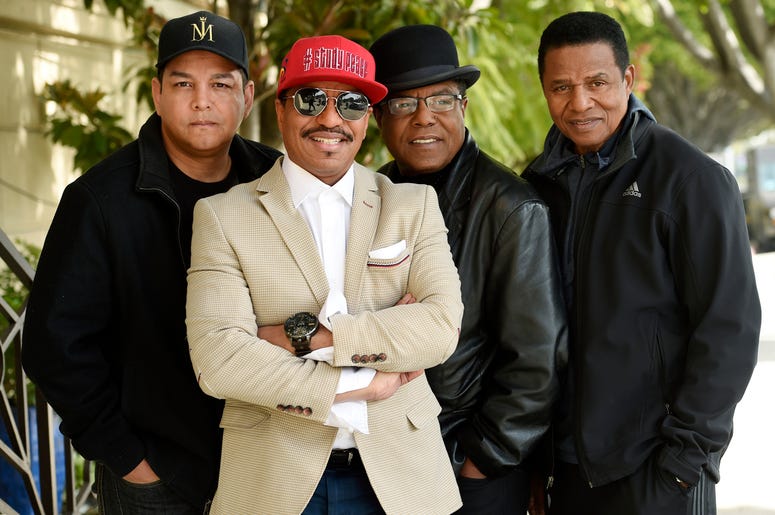 AP19057792689435 In this Tuesday, Feb. 26, 2019 photo, Marlon Jackson, second from left, Tito Jackson, second from right, and Jackie Jackson, far right, brothers of the late musical artist Michael Jackson, and Tito's son Taj, far left, pose together for a portrait outside