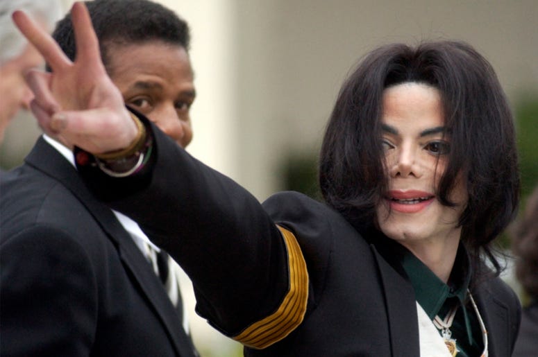 AP19064268830846 In this March 2, 2005, file photo, pop icon Michael Jackson waves to his supporters as he arrives for his child molestation trial at the Santa Barbara County Superior Court in Santa Maria, Calif. (AP Photo/Michael A. Mariant, File)