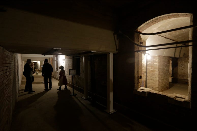 AP19065732671669 In this July 1, 2015 file photo, people walk through the citadel, also known as the the dungeon, during a tour of newly restored areas on Alcatraz Island in San Francisco. (AP Photo/Eric Risberg)