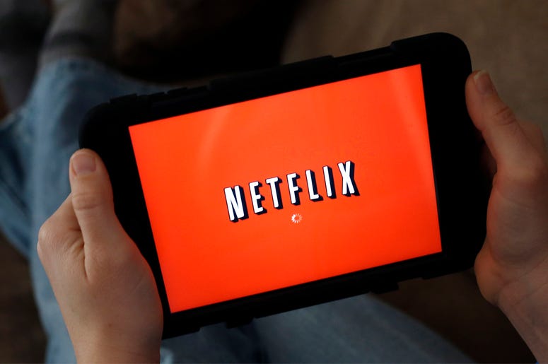 AP19077580844265 In this Friday, Jan. 17, 2014, file photo, a person displays Netflix on a tablet in North Andover, Mass. (AP Photo/Elise Amendola, File)