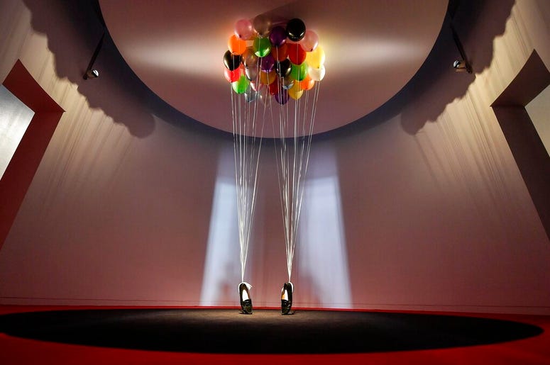 AP19080418958103 sculpture, comprised of balloons lifting a pair of penny loafer shoes by British artist Appau Junior Boakye-Yiadom is shown at a preview of the exhibition 'Michael Jackson: On The Wall' at the Bundeskunsthalle museum in Bonn, Germany, Thursday, March 21,