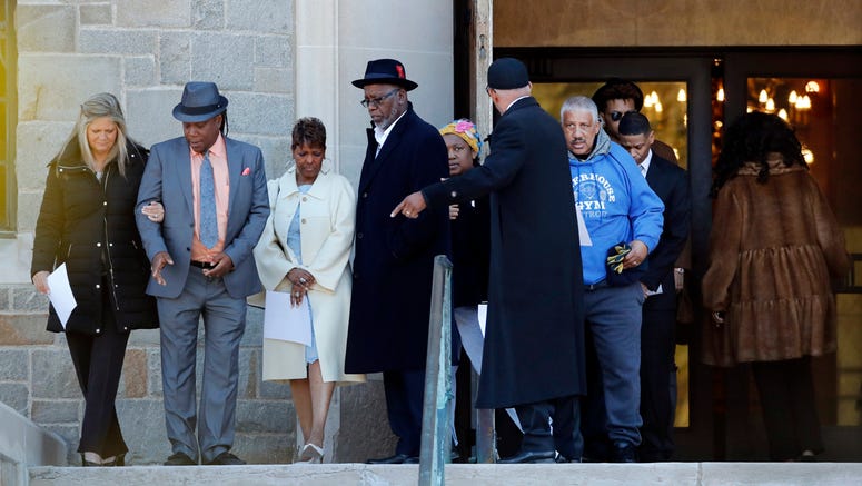 AP19084652007502 Family members of the late Aretha Franklin gather before entering the Mausoleum Chapel at the Woodlawn Cemetery, Monday, March 25, 2019, in Detroit. (AP Photo/Carlos Osorio)