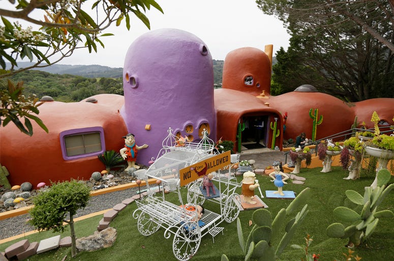 AP19091858524046 In this photo taken Monday, April 1, 2019, is an exterior view of the Flintstone House in Hillsborough, California. (AP Photo/Eric Risberg)