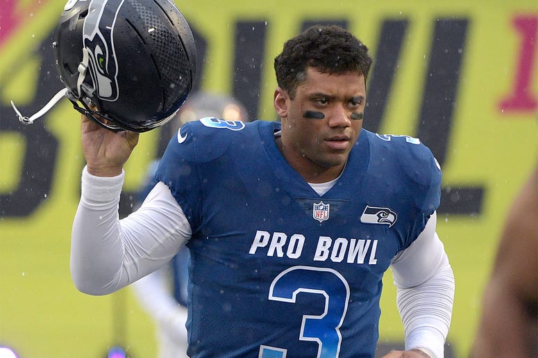 AP19106349787649 In this Jan. 27, 2019, file photo, NFC quarterback Russell Wilson of the Seattle Seahawks runs onto the field during player introductions before the NFL Pro Bowl football game against the AFC in Orlando, Florida. (AP Photo/Phelan M. Ebenhack, File)