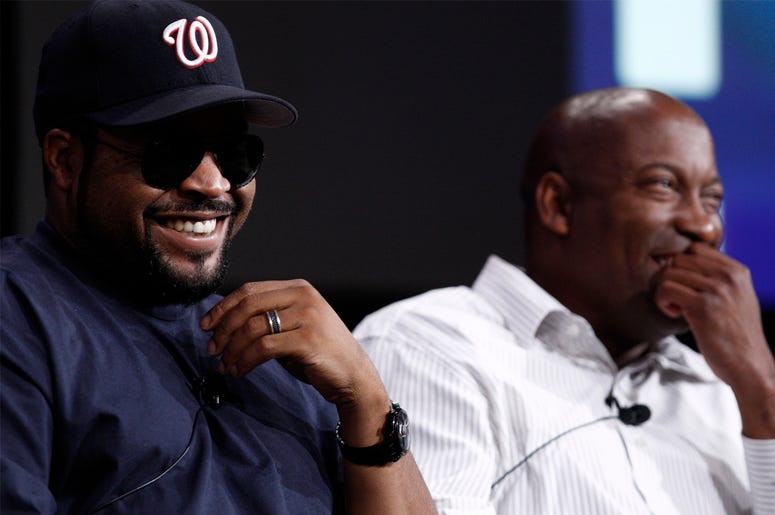 AP19120653716553 In this July 29, 2008, file photo, Ice Cube, left, and director John Singleton, laugh during the ESPN panel for the documentary series "30 for 30" at the Television Critics Association summer press tour in Pasadena, California. (AP Photo/Matt Sayles, File