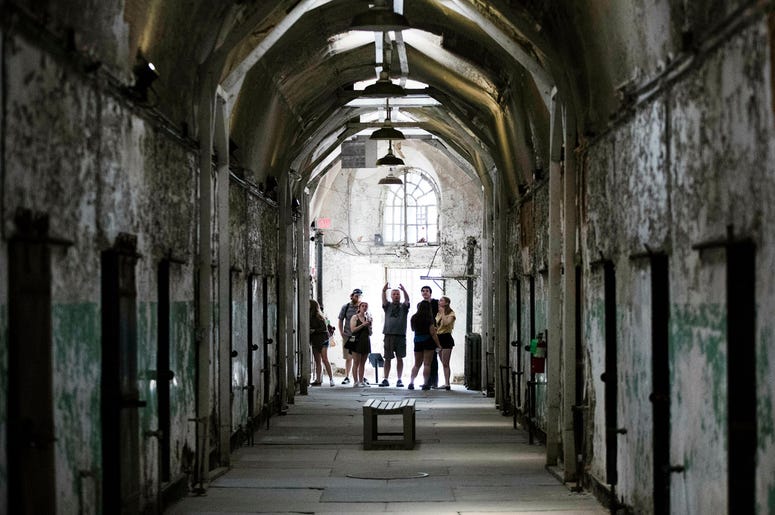 AP19122682432257 Tourist visit a cellblock of the Eastern State Penitentiary, Thursday, May 2, 2019, which is now a museum in Philadelphia. (AP Photo/Matt Rourke)