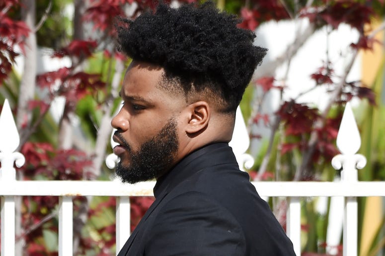 AP19126645689418 Director Ryan Coogler arrives at a memorial service for the late film director John Singleton at Angelus Funeral Home, Monday, May 6, 2019, in Los Angeles. Singleton died on April 29 following a stroke. (AP Photo/Chris Pizzello)
