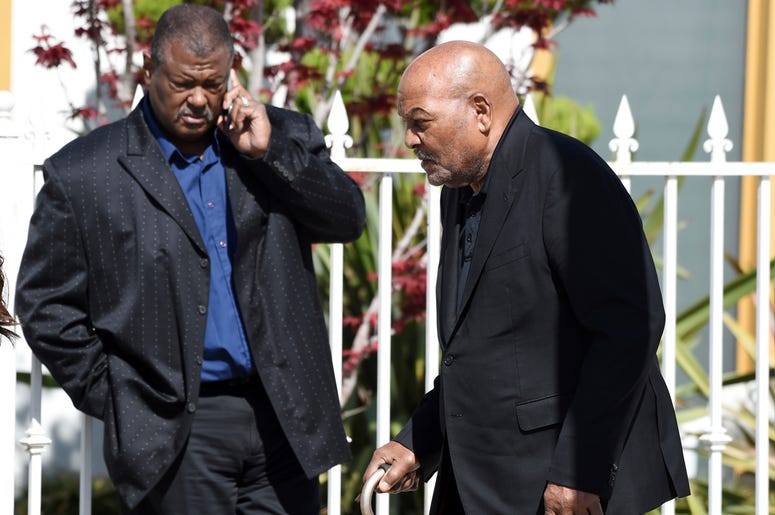 AP19126648432011 NFL football legend and actor Jim Brown, right, arrives at a memorial service for the late film director John Singleton at Angelus Funeral Home, Monday, May 6, 2019, in Los Angeles. Singleton died on April 29 following a stroke. (AP Photo/Chris Pizzello)