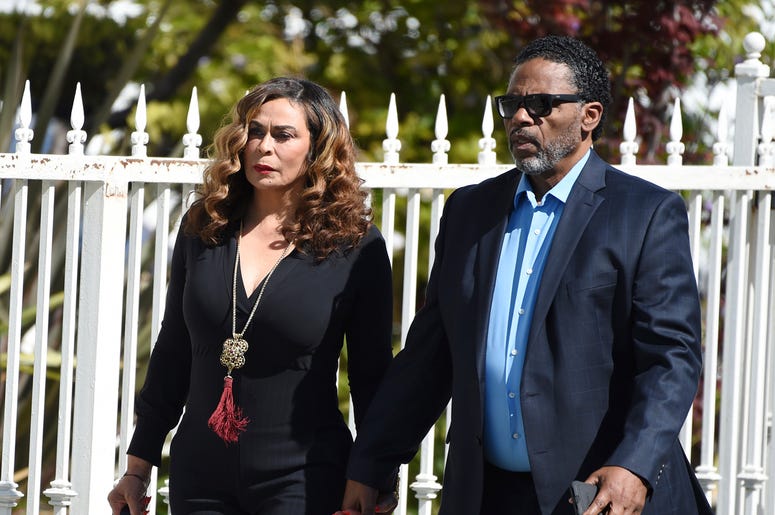 AP19126653041515 Tina Knowles, left, and husband Richard Lawson arrive at a memorial service for the late film director John Singleton at Angelus Funeral Home, Monday, May 6, 2019, in Los Angeles. Singleton died on April 29 following a stroke. (AP Photo/Chris Pizzello)