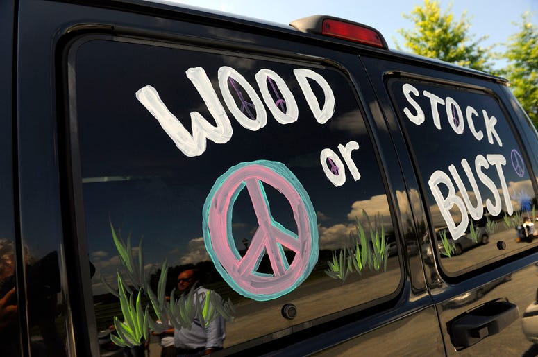 AP19130036660999 This Aug. 14, 2009 file photo shows a van decorated with "Woodstock or Bust" at the original Woodstock Festival site in Bethel, N.Y. (AP Photo/Stephen Chernin, File)