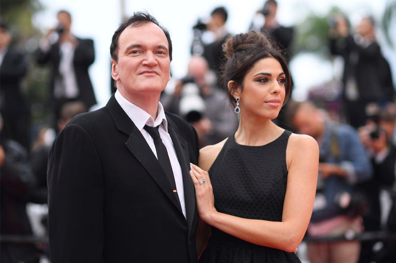 AP19138567488135 Film director Quentin Tarantino and his wife Daniela Pick pose for photographers upon arrival at the premiere of the film 'The Wild Goose Lake' at the 72nd international film festival, Cannes, southern France, Saturday, May 18, 2019. (Photo by Arthur Mola