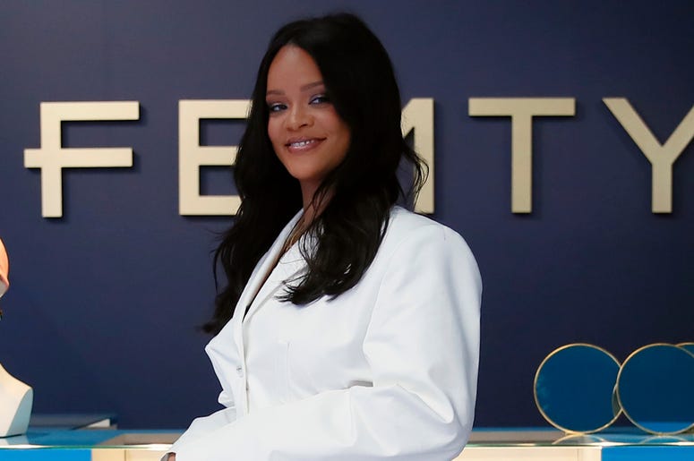 AP19142710633963 Rihanna poses as she unveils her first fashion designs for Fenty at a pop-up store in Paris, France, Wednesday, May 22. (AP Photo/Francois Mori)