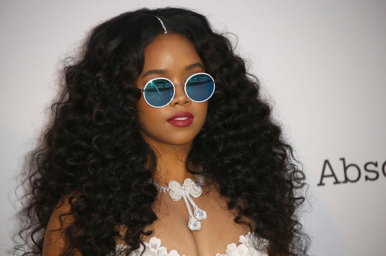 AP19143664376829 Singer H.E.R. poses for photographers upon arrival at the amfAR, Cinema Against AIDS, benefit at the Hotel du Cap-Eden-Roc, during the 72nd international Cannes film festival, in Cap d'Antibes, southern France, Thursday, May 23, 2019. (Photo by Joel C Rya