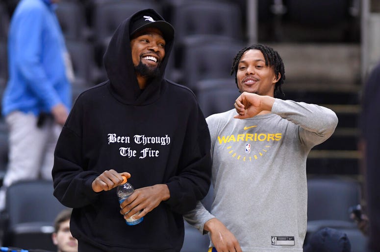 Golden State Warriors Kevin Durant laughs with teammate Damion Lee Golden State Warriors Kevin Durant laughs with teammate Damion Lee