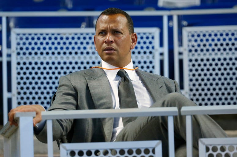AP19175228518605 In this June 23, 2017, file photo, former baseball player Alex Rodriguez sits in the stands before the start of a baseball game in Miami. (AP Photo/Wilfredo Lee, File)