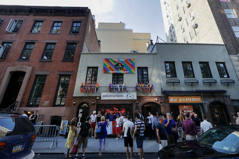 AP19178855207951 People gather near the Stonewall Inn Thursday, June 27, 2019, in New York. (AP Photo/Frank Franklin II)