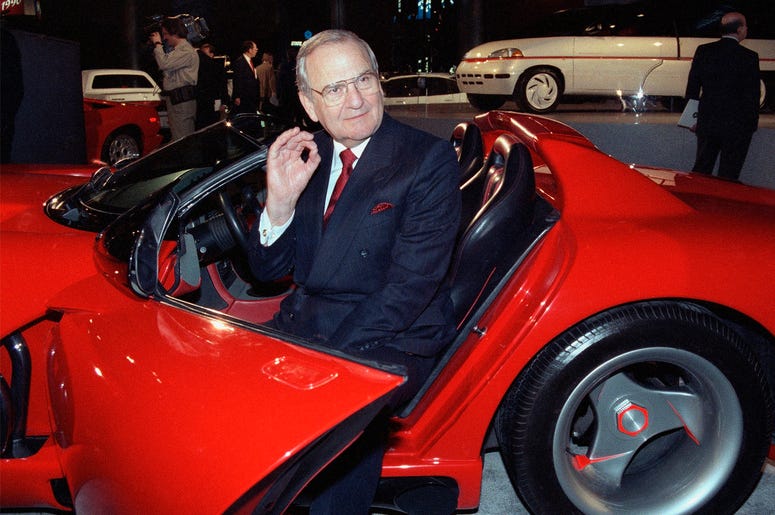AP19184047394114 In this March 28, 1990, file photo, Chrysler Corporation Chairman Lee Iacocca sits in a 1990 Dodge Viper sports car as the Chrysler in the 90's six city tour makes a visit to New York. (AP Photo/Osamu Honda, File)