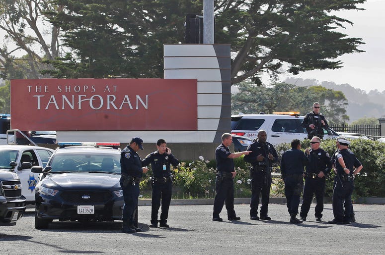 AP19184055187305 Police investigate at the scene of a shooting at the Tanforan Mall in San Bruno, Calif., Tuesday, July 2, 2019. (AP Photo/Stephanie Mullen)
