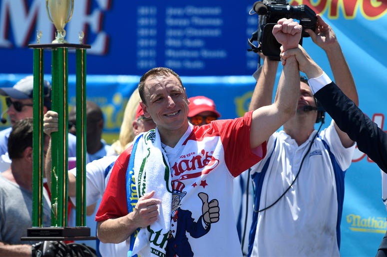 AP19185625926927 Joey Chestnut reacts after winning the men's competition of Nathan's Famous July Fourth hot dog eating contest, Thursday, July 4, 2019, in New York's Coney Island. (AP Photo/Sarah Stier)