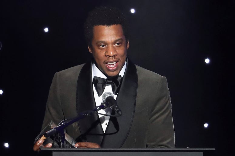 AP19186586768342 In this Jan. 27, 2018, file photo, honoree Jay-Z speaks onstage at the 2018 Pre-Grammy Gala And Salute To Industry Icons at the Sheraton New York Times Square Hotel in New York. (Photo by Michael Zorn/Invision/AP, File)