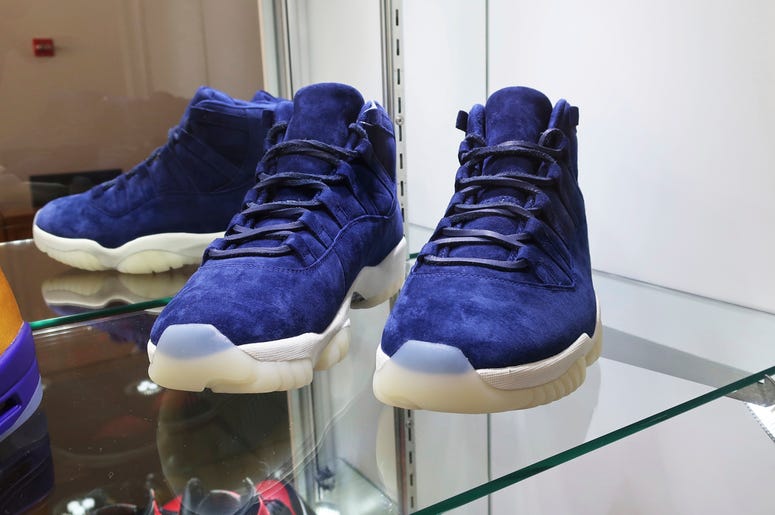 AP19193776543928 A pair of 2017 "Air Jordan 11 Jeter Derek Jeter" shoes are on display at Sotheby's auction house in New York on July 12, 2019. Sotheby's expects the shoes to auction online for $40,000 to $60,000. (AP Photo/Ted Shaffrey)