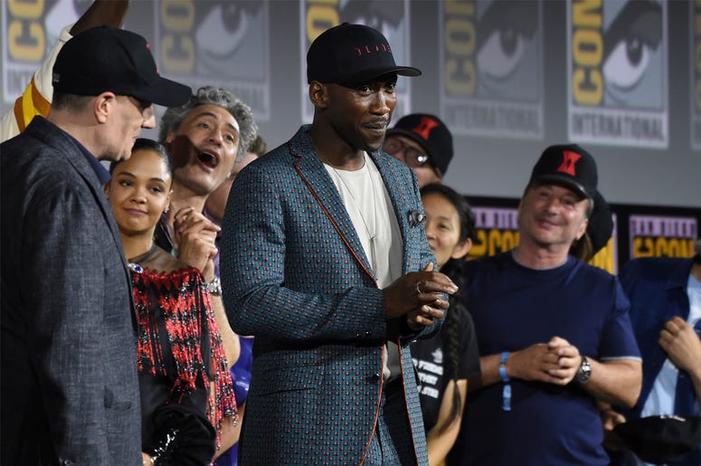 AP19202089253965 Mahershala Ali, center, wears a hat to promote his new movie "Blade" at the Marvel Studios panel on day three of Comic-Con International on Saturday, July 20, 2019, in San Diego. (Photo by Chris Pizzello/Invision/AP)