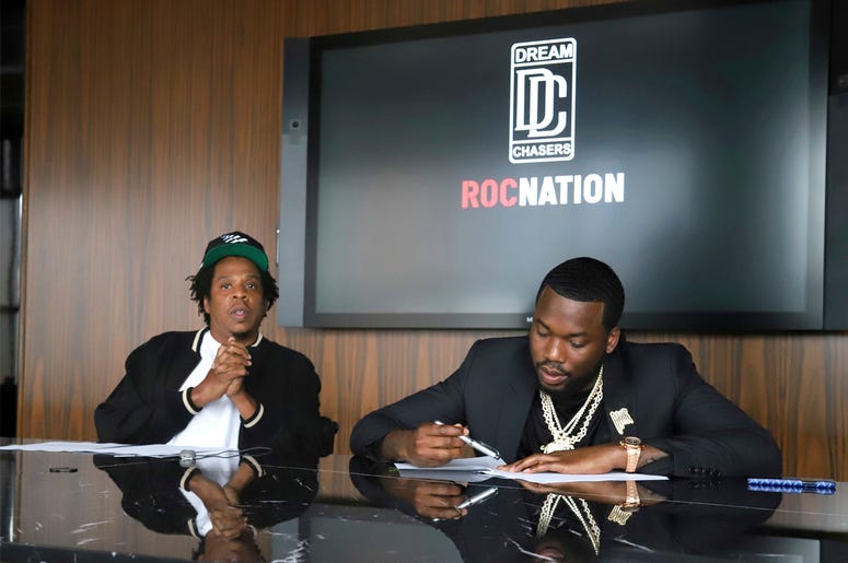 AP19204774543089 Jay-Z, left, and Meek Mill make an announcement of the launch of Dream Chasers record label in joint venture with Roc Nation, at the Roc Nation headquarters on Tuesday, July 23, 2019, in New York. (Photo by Greg Allen/Invision/AP)