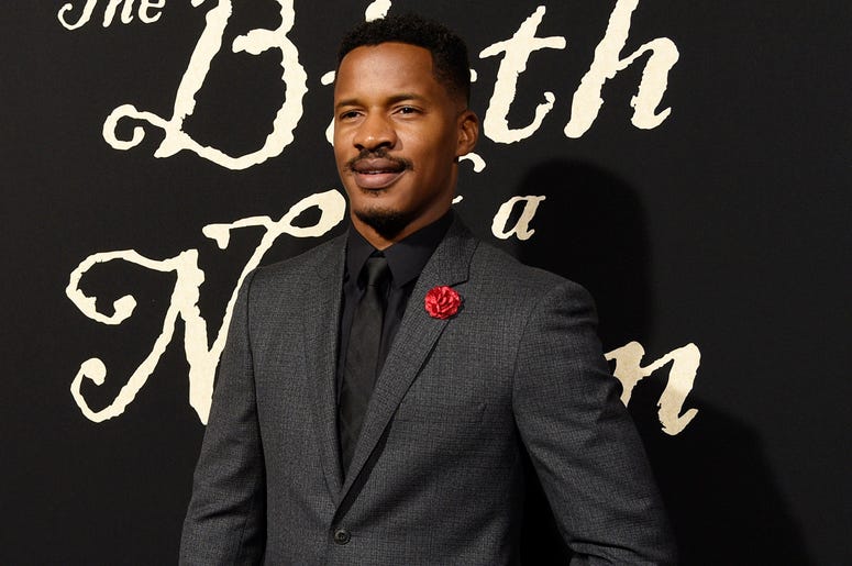 AP19219565163581 This Sept. 21, 2016 file photo shows Nate Parker, the director, screenwriter and star of "The Birth of a Nation" at the premiere of the film in Los Angeles. (Photo by Chris Pizzello/Invision/AP, File)