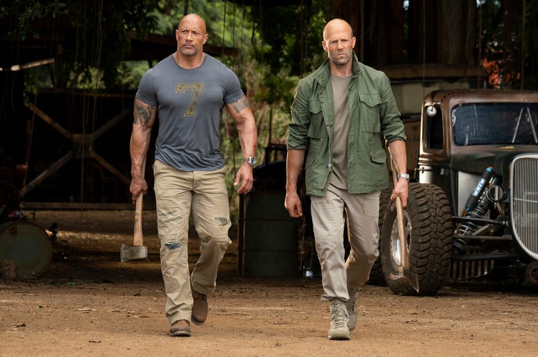 AP19223559701765 This image released by Universal Pictures shows Dwayne Johnson, left, and Jason Statham in a scene from "Fast & Furious Presents: Hobbs & Shaw." (Photo credit: Frank Masi/Universal Pictures via AP)