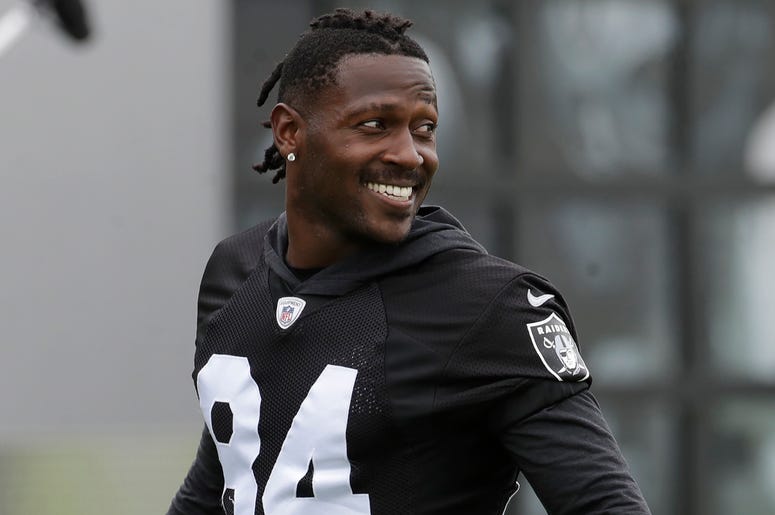 AP19232670773312 In this Aug. 20, 2019 file photo, Oakland Raiders' Antonio Brown smiles before stretching during NFL football practice in Alameda, Calif. Brown was released by the Raiders, Saturday, Sept. 7, 2019. (AP Photo/Jeff Chiu, File)