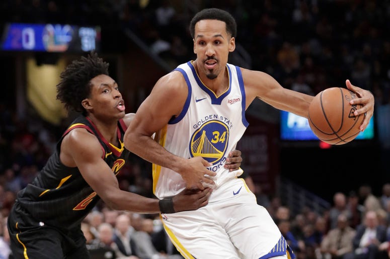 AP19256740725499 In this Dec. 5, 2018, file photo, Golden State Warriors' Shaun Livingston (34) drives past Cleveland Cavaliers' Collin Sexton (2) in the second half of an NBA basketball game in Cleveland. (AP Photo/Tony Dejak, File)