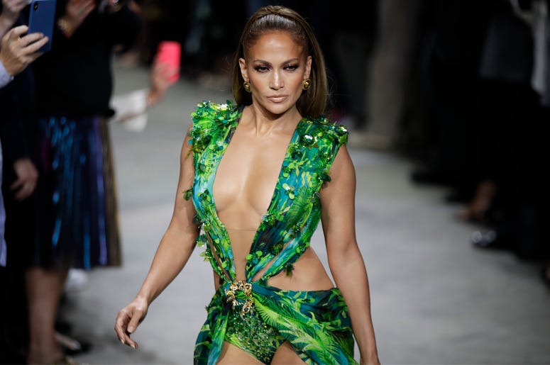 AP19263703493150 Actress Jennifer Lopez wears a creation as part of the Versace Spring-Summer 2020 collection, unveiled during the fashion week, in Milan, Italy, Friday, Sept. 20, 2019. (AP Photo/Luca Bruno)