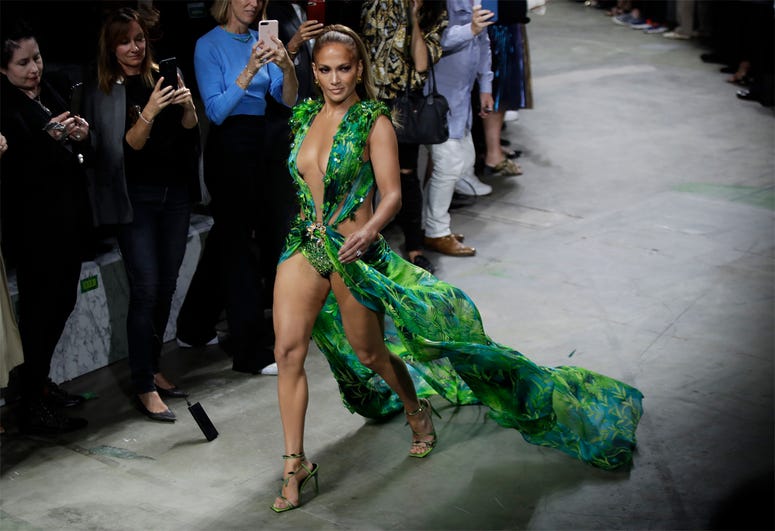 AP19263703602801 Actress Jennifer Lopez wears a creation as part of the Versace Spring-Summer 2020 collection, unveiled during the fashion week, in Milan, Italy, Friday, Sept. 20, 2019. (AP Photo/Luca Bruno)