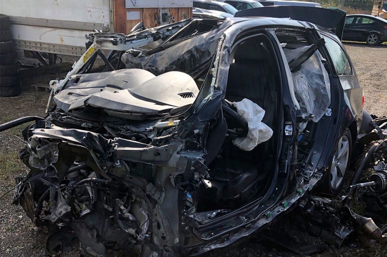 AP19274624820099 This Tuesday, Oct. 1, 2019 photo, released by the Ontario Provincial Police, shows the a smashed up vehicle involved in a fatal crash with transport truck near Shelburne, Ontario. (Ontario Provincial Police/The Canadian Press via AP)