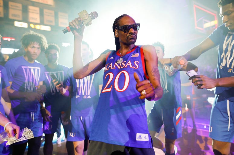 AP19278745494841 In this Friday, Oct. 4, 2019 photo, rapper Snoop Dogg performs for the Allen Fieldhouse crowd during Late Night in the Phog, Kansas' annual NCAA college basketball kickoff at Allen Fieldhouse in Lawrence, Kan. (Nick Krug/The Lawrence Journal-World via AP)
