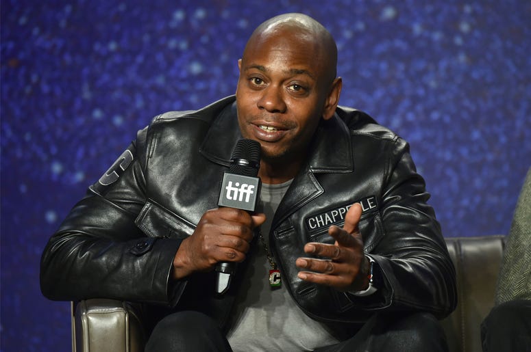 AP19299525445891 In this Sept. 8, 2018 file photo, Dave Chappelle speaks at the press conference for "A Star Is Born" on day 4 of the Toronto International Film Festival at the TIFF Bell Lightbox in Toronto. (Photo by Evan Agostini/Invision/AP, File)