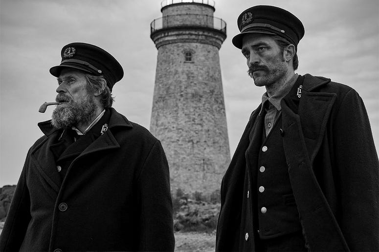 Willem Dafoe, left, and Robert Pattinson in a scene from "The Lighthouse" This image released by A24 Films shows Willem Dafoe, left, and Robert Pattinson in a scene from "The Lighthouse." (Eric Chakeen/A24 Pictures via AP)
