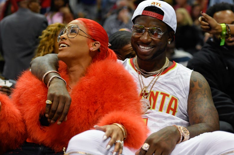 Rapper Gucci Mane and fiancee Keyshia Ka'oir at New Orleans Pelicans and Atlanta Hawks NBA game. Gucci Mane reacts with Keyshia Ka'oir after being engaged during a time out during the New Orleans Pelicans and Atlanta Hawks game during the second half at Philips Arena.