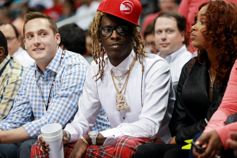 Rapper Young Thug at game two of the first round of the NBA Playoffs. Rapper Young Thug during the second quarter of game two of the first round of the NBA Playoffs between Brooklyn Nets and Atlanta Hawks at Philips Arena.