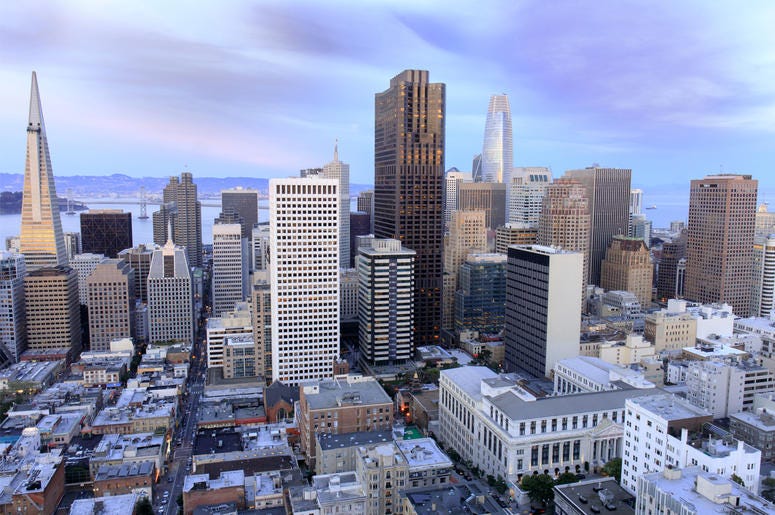 San Francisco Financial District Aerial view of San Francisco Financial District as seen from a building rooftop in Nob Hill at dusk. (Photo credit: Yuval Helfman/Dreamstime)