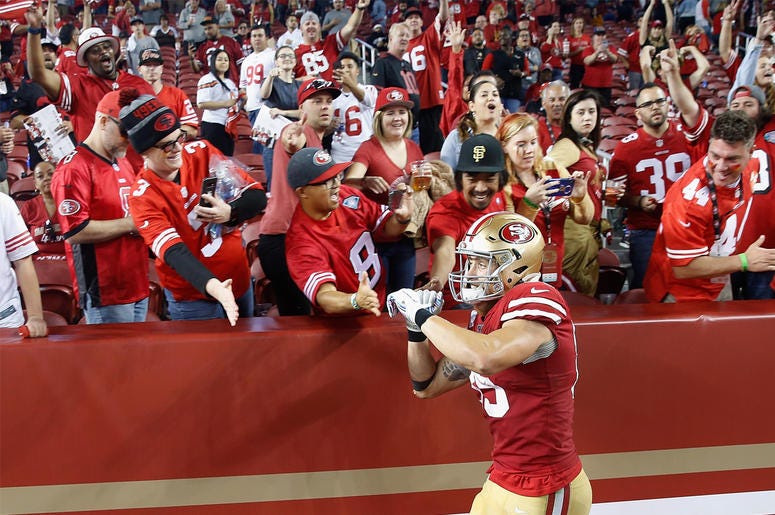 George Kittle #85 of the San Francisco 49ers celebrates with fans SANTA CLARA, CALIFORNIA - OCTOBER 07: George Kittle #85 of the San Francisco 49ers celebrates with fans after a win against the Cleveland Browns at Levi's Stadium on October 07, 2019 in Santa Clara, California. (Photo by Lachlan Cunningham/Getty Images)
