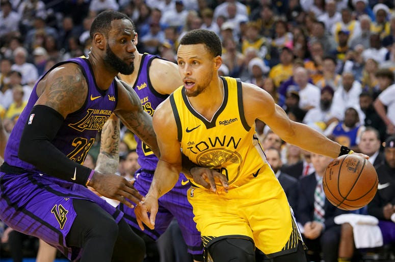 Los Angeles Lakers forward LeBron James and Golden State Warriors guard Stephen Curry December 25, 2018; Oakland, CA, USA; Golden State Warriors guard Stephen Curry (30) dribbles the basketball against Los Angeles Lakers forward LeBron James (23) during the third quarter at Oracle Arena. Mandatory Credit: Kyle Terada-USA TODAY Sports