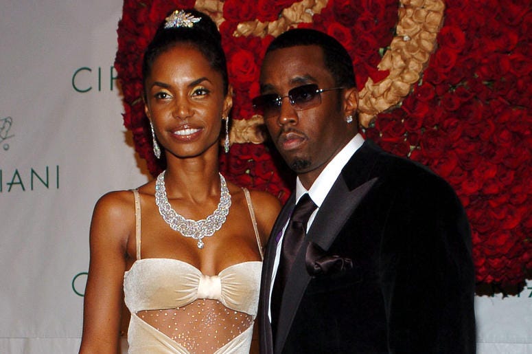 Kim Porter and Diddy in 2004 KRT ENTERTAINMENT STAND ALONE PHOTO SLUGGED: PDIDDYBIRTHDAYBALL KRT PHOTOGRAPH BY NICOLAS KHAYAT/ABACA PRESS (November 5) Sean "P. Diddy" Combs and his girlfriend Kim Porter attend the "P. Diddy Royal Birthday Ball" celebrating P. Diddy's 35th birthday, h