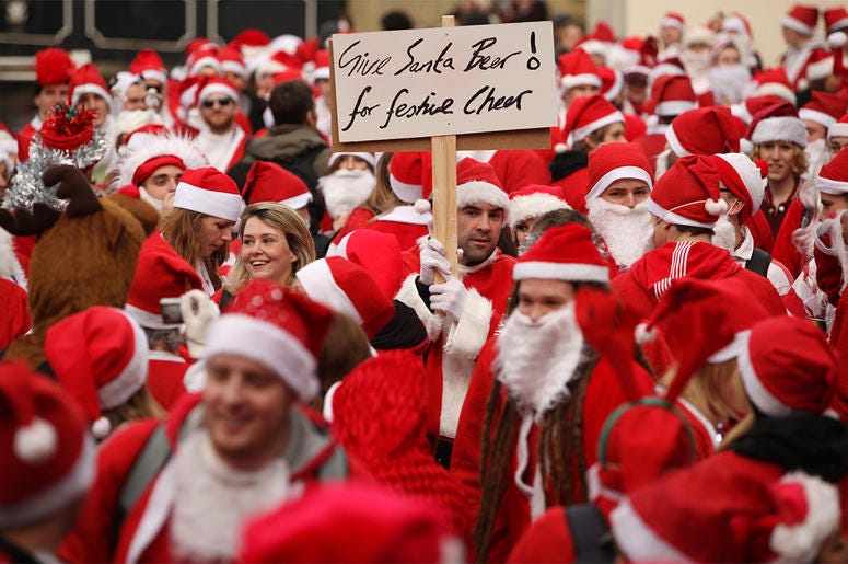 Dressed Up As Santa For "SantaCon" Pub Crawl LONDON, ENGLAND - DECEMBER 12: Londoners dressed in Santa Claus costumes participate in 'SantaCon', a Santa-themed pub crawl across the capital, on December 12, 2009 in London, England. Similar SantaCon events take place in various cities around the world