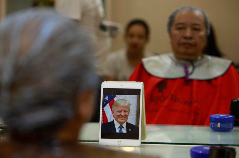 e Phuc Hai, 66, receives a Trump haircut in Hanoi, Vietnam, on Tuesday, Feb. 19, 2019. U.S. President Donald Trump and North Korean leader Kim Jong Un have become the latest style icons in Hanoi, a week before their second summit is to be held in the capi
