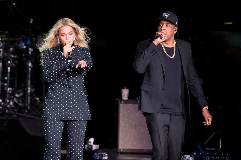 AP18197603519874 In this Nov. 4, 2016 file photo, Beyonce, center, and Jay-Z perform during a Democratic presidential candidate Hillary Clinton campaign rally in Cleveland. Beyonce and Jay-Z, who recently released a collaborative album as The Carters, are nominated for ei