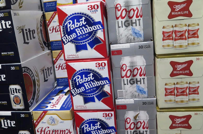 AP18313644230355 In this photo taken on Thursday, Nov. 8, 2018, cases of Pabst Blue Ribbon and Coors Light are stacked next to each other in a Milwaukee liquor store. Pabst Brewing Company and MillerCoors are heading to trial starting Monday, Nov. 12, to settle a contract