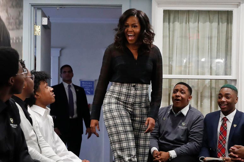 AP18345748657595 Former First Lady Michelle Obama surprises students from Wayne State University during a discussion at the Motown Museum in Detroit, Tuesday, Dec. 11, 2018. (AP Photo/Paul Sancya)