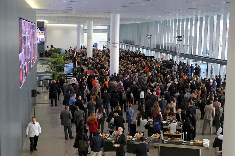 AP19003750648592 People listen to a number of speeches during the Moscone Center expansion opening Thursday, Jan. 3, 2019, in San Francisco. Completion of the $550 million expansion was celebrated by city officials, tourism industry leaders and neighborhood stakeholders.